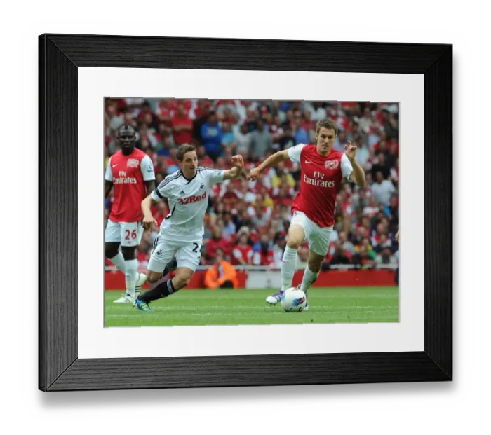 Framed Print : Aaron Ramsey (Arsenal) Joe Allen (Swansea). Arsenal 1: 0 Swansea City. Barclays Premier League