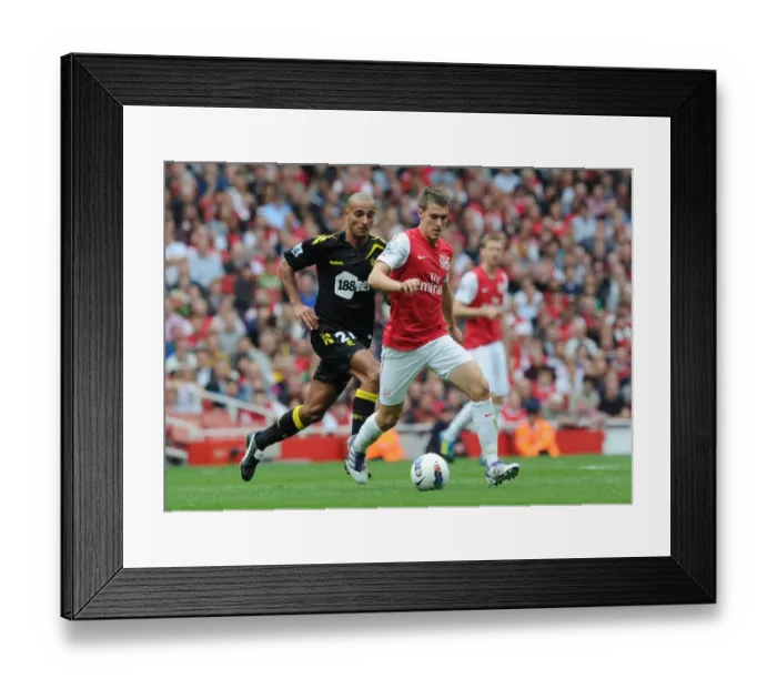 Framed Print : Arsenal's Ramsey Outmaneuvers Bolton's Pratley in 2011-12 Premier League Clash