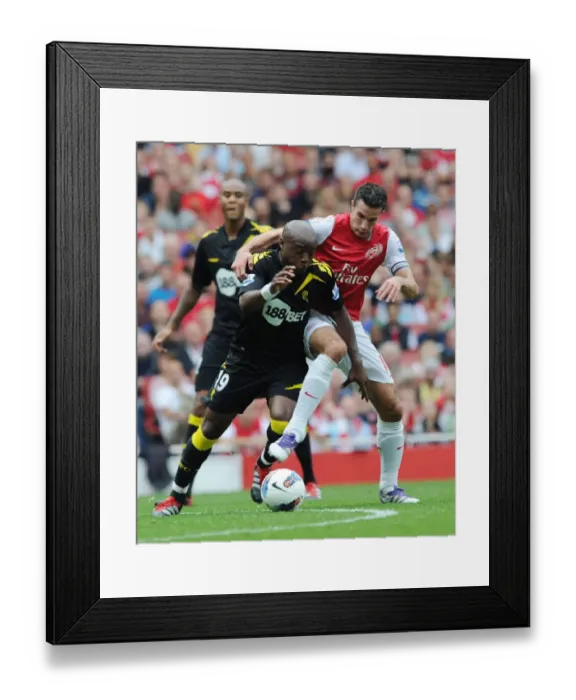Framed Print : Arsenal's Robin van Persie vs. Nigel Reo-Coker: Intense Clash during Arsenal v Bolton Wanderers (2011-12) Framed Print : Arsenal's Robin van Persie vs. Nigel Reo-Coker: Intense Clash during Arsenal v Bolton Wanderers (2011-12)