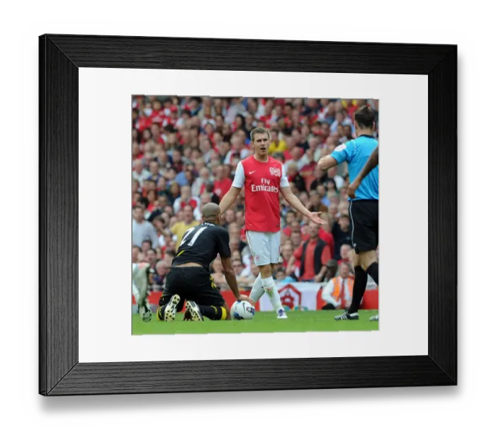 Framed Print : Arsenal's Aaron Ramsey Contests Referee's Call Amidst Arsenal's 3-0 Victory Over Bolton Wanderers Framed Print : Arsenal's Aaron Ramsey Contests Referee's Call Amidst Arsenal's 3-0 Victory Over Bolton Wanderers
