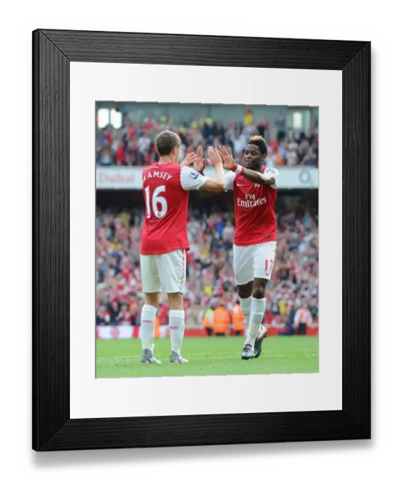 Framed Print : Alex Song celebrates scoring Arsenals 3rd goal with Aaron Ramsey. Arsenal 3: 0 Bolton Wanderers Framed Print : Alex Song celebrates scoring Arsenals 3rd goal with Aaron Ramsey. Arsenal 3: 0 Bolton Wanderers