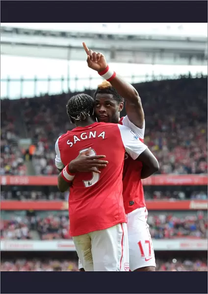 Arsenal's Triumph: Alex Song and Bacary Sagna's Celebration after 3-0 Win over Bolton Wanderers in the Premier League