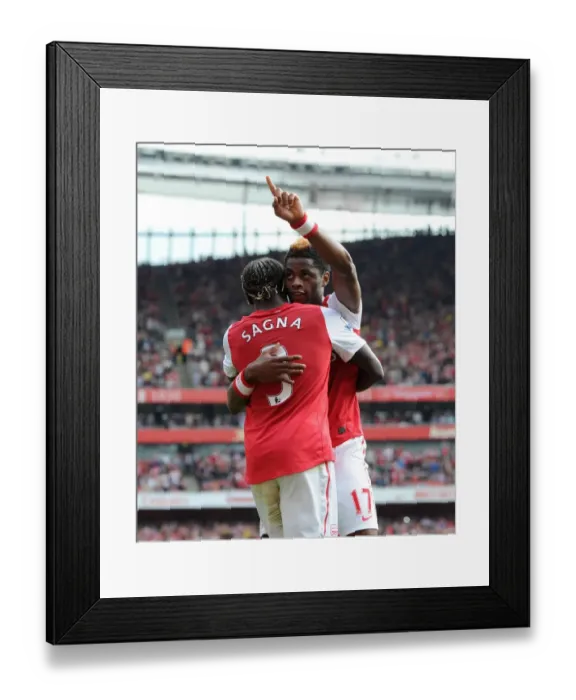 Framed Print : Arsenal's Triumph: Alex Song and Bacary Sagna's Celebration after 3-0 Win over Bolton Wanderers in the Premier League