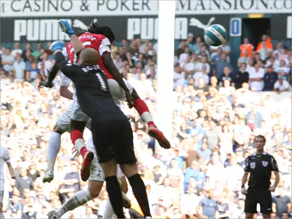 Emmanuel Adebayor heads past Tottenham goalkeeper Paul Robinson to score the 1st Arsenal goal