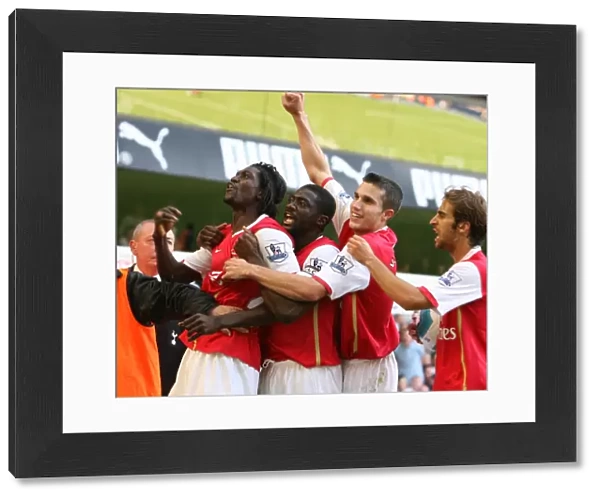 Emmanuel Adebayor (Arsenal) celebrates scoring the 1st Arsenal goal with Kolo Toure