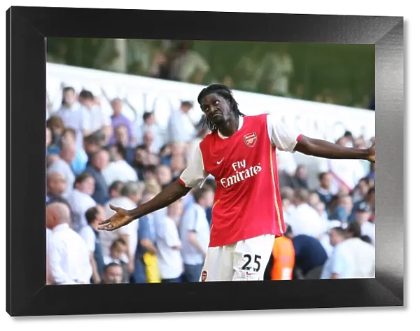 Emmanuel Adebayor celebrates scoring the 3rd Arsenal goal