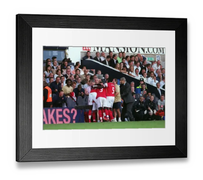 Framed Print : Cesc Fabregas celebrates scoring Arsenals 2nd goal with the Arsenal bench Framed Print : Cesc Fabregas celebrates scoring Arsenals 2nd goal with the Arsenal bench