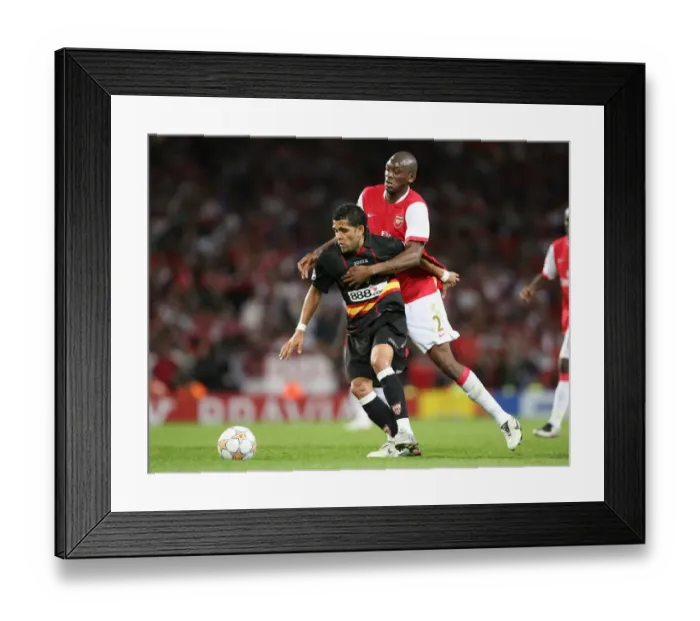 Framed Print : Abou Diaby (Arsenal) Daniel Alves (Sevilla) Framed Print : Abou Diaby (Arsenal) Daniel Alves (Sevilla)