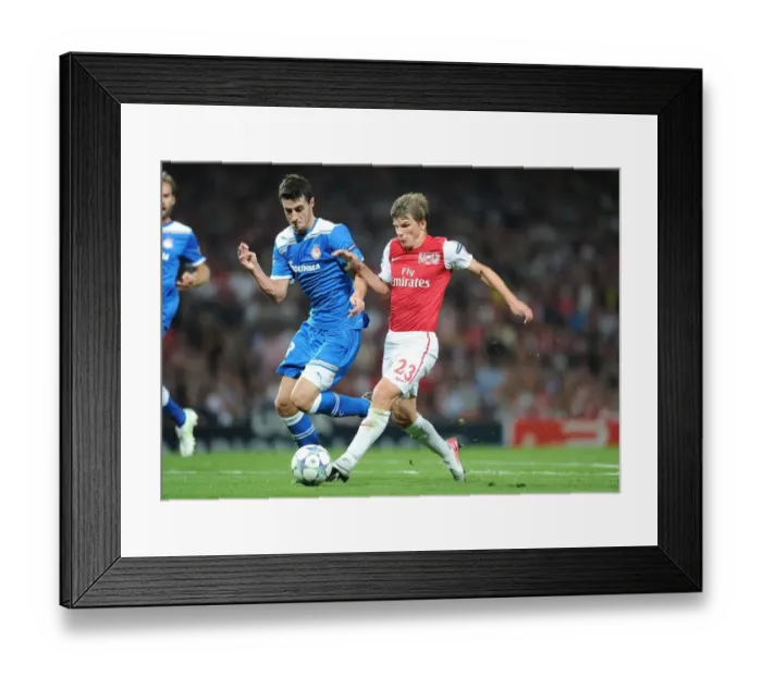 Framed Print : Arshavin vs Marcano: A Battle in the Arsenal-Olympiacos UEFA Champions League Clash Framed Print : Arshavin vs Marcano: A Battle in the Arsenal-Olympiacos UEFA Champions League Clash