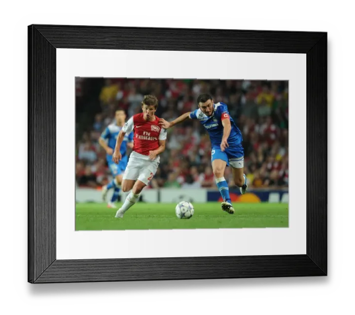 Framed Print : Arshavin vs. Torossidis: A Battle in the Arsenal-Olympiacos UEFA Champions League Clash Framed Print : Arshavin vs. Torossidis: A Battle in the Arsenal-Olympiacos UEFA Champions League Clash