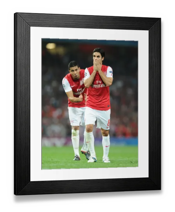 Framed Print : Arsenal FC vs Olympiacos FC: Mikel Arteta and Andre Santos in Action, UEFA Champions League 2011-12