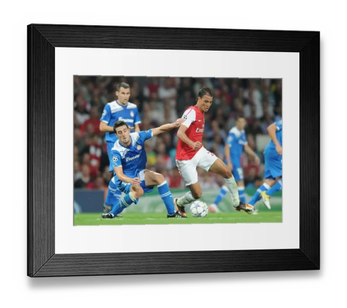 Framed Print : Arsenal's Marouane Chamakh Clashes with Olympiacos Ivan Marcano in 2011 Champions League Showdown Framed Print : Arsenal's Marouane Chamakh Clashes with Olympiacos Ivan Marcano in 2011 Champions League Showdown