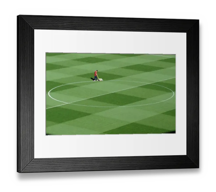 Framed Print : Arsenal's Groundsman Paul Ashcroft Prepares the Emirates Pitch for Arsenal's 2:1 UEFA Champions League Victory over Olympiacos (Group F) Framed Print : Arsenal's Groundsman Paul Ashcroft Prepares the Emirates Pitch for Arsenal's 2:1 UEFA Champions League Victory over Olympiacos (Group F)