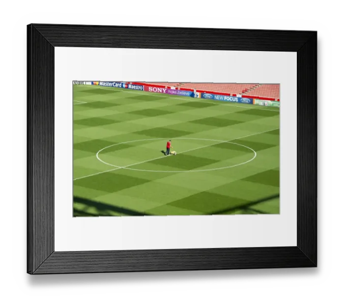 Framed Print : Arsenal's Groundsman Paul Ashcroft Readies Emirates Pitch for Champions League Victory over Olympiacos Framed Print : Arsenal's Groundsman Paul Ashcroft Readies Emirates Pitch for Champions League Victory over Olympiacos