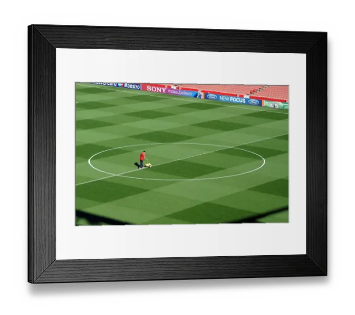 Framed Print : Arsenal's Groundsman Paul Ashcroft Prepares Emirates Pitch for Champions League Glory