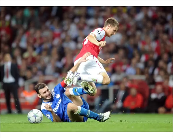 Aaron Ramsey (Arsenal) Vassilis Torossidis (Olympiacos). Arsenal 2: 1 Olympiacos