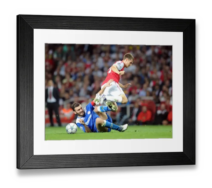 Framed Print : Aaron Ramsey (Arsenal) Vassilis Torossidis (Olympiacos). Arsenal 2: 1 Olympiacos Framed Print : Aaron Ramsey (Arsenal) Vassilis Torossidis (Olympiacos). Arsenal 2: 1 Olympiacos