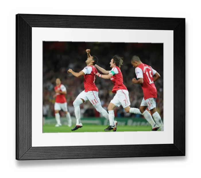 Framed Print : Arsenal Celebrate: Rosicky and Santos Score in Champions League Win over Olympiacos (2011-12)