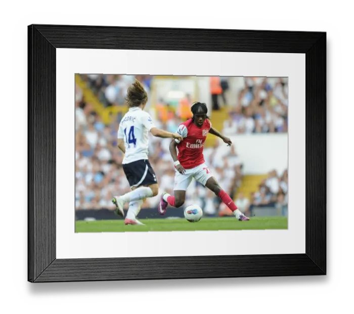 Framed Print : Gervinho vs Modric: Tottenham Hotspur Edge Past Arsenal 2-1 in Premier League Clash, 2011 Framed Print : Gervinho vs Modric: Tottenham Hotspur Edge Past Arsenal 2-1 in Premier League Clash, 2011