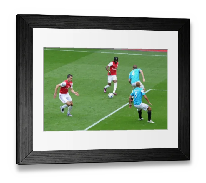 Framed Print : Gervinho (Arsenal) passes the ball to Robin van Persie to score Arsenals 1st goal under pressure from Michael Turner (Sunderland). Arsenal 2: 1 Sunderland. Barclays Premier League. Emirates Stadium, 16 / 10 / 11. Credit : Arsenal Football Club / Framed Print : Gervinho (Arsenal) passes the ball to Robin van Persie to score Arsenals 1st goal under pressure from Michael Turner (Sunderland). Arsenal 2: 1 Sunderland. Barclays Premier League. Emirates Stadium, 16 / 10 / 11. Credit : Arsenal Football Club /