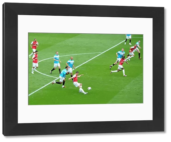 Robin van Persie (Arsenal) chips the ball against the post under pressure from Kieran Richardson