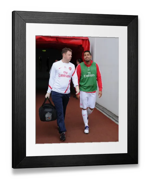 Framed Print : Arsenal's Colin Lewin Tends to Injured Andre Santos vs Sunderland (2011-12)