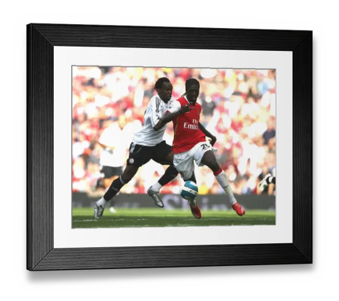 Framed Print : Emmanuel Adebayor beats Claude Davis Framed Print : Emmanuel Adebayor beats Claude Davis