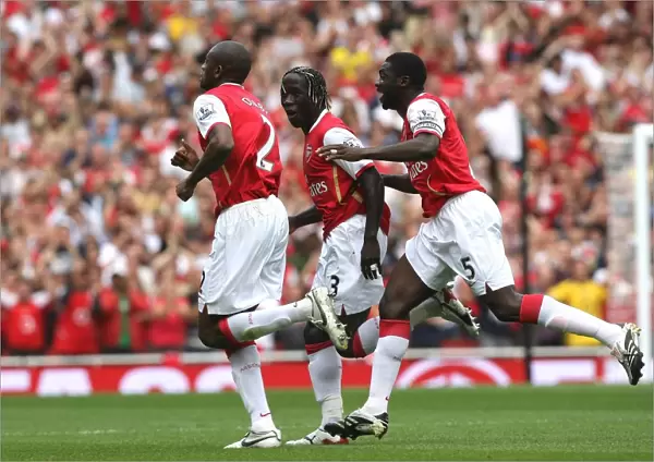 Abou Diaby celebrates scoring his goal Arsenals 1st with Bacary Sagna and Kolo Toure