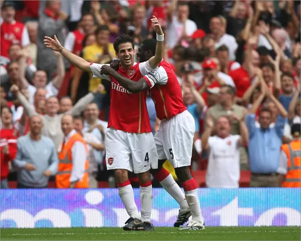 Cesc Fabregas celebrates scoring Arsenals 4th goal with Kolo Toure