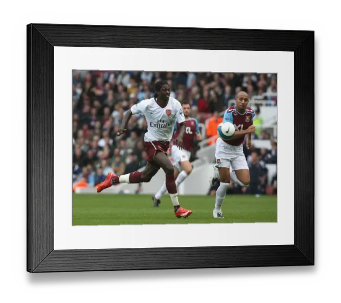 Framed Print : Adebayor Scores the Winner: Arsenal Triumph Over West Ham in BPL Clash