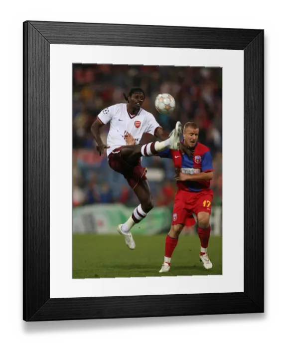 Framed Print : Adebayor's Strike: Arsenal Triumphs Over Steaua in Champions League (2007)