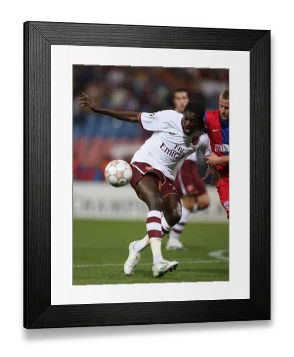 Framed Print : Emmanuel Adebayor (Arsenal) Eugen Baciu (Steaua) Framed Print : Emmanuel Adebayor (Arsenal) Eugen Baciu (Steaua)