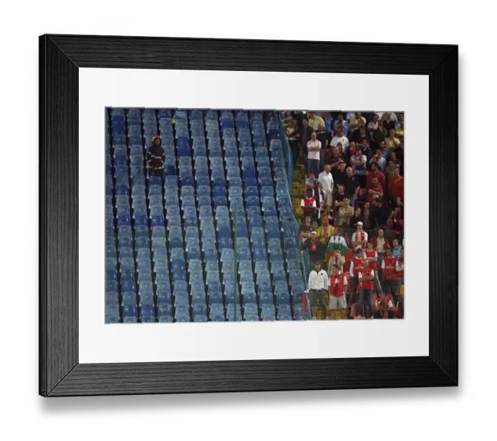 Framed Print : A Rominian Policeman keeps an eye on the Arsenal fans Framed Print : A Rominian Policeman keeps an eye on the Arsenal fans