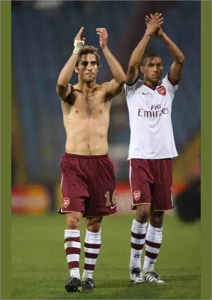 Mathieu Flamini and Gael Clichy (Arsenal) clap the fans at the end of the match