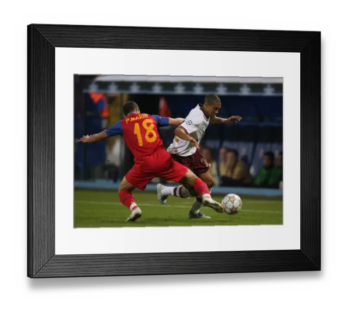 Framed Print : Gael Clichy (Arsenal) Petre Marin (Steaua) Framed Print : Gael Clichy (Arsenal) Petre Marin (Steaua)
