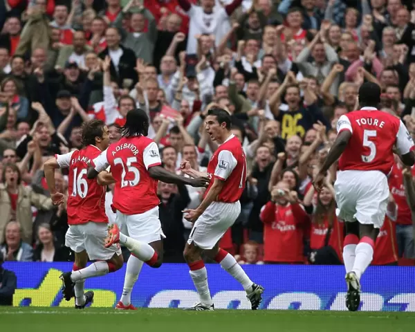 Robin van Persie celebrates scoring Arsenals and his 1st goal with Mathieu Flamini
