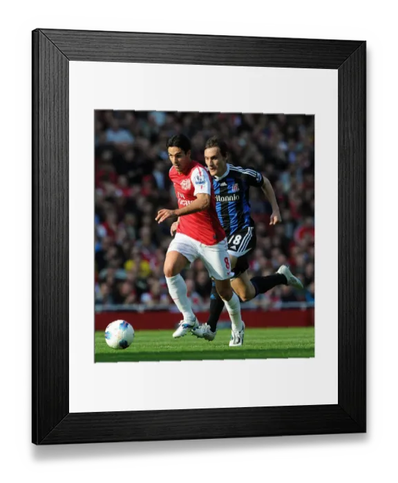 Framed Print : Mikel Arteta's Goal Seals 3-1 Arsenal Victory over Stoke City (2011)