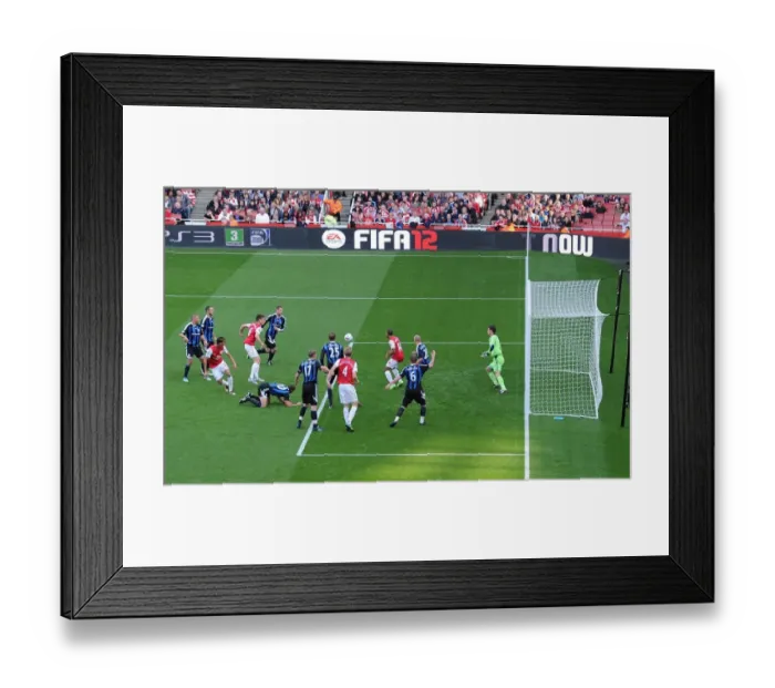 Framed Print : Arsenal's Triumph: Crowded Emirates Goalmouth Seces Arsenal's 3-1 Victory Over Stoke City in the Premier League (2011-2012)