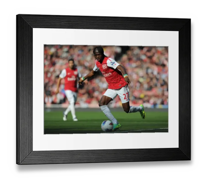 Framed Print : Arsenal Triumphs Over Stoke City 3:1 in Premier League: Gervinho's Brilliant Performance at Emirates Stadium (October 23, 2011)