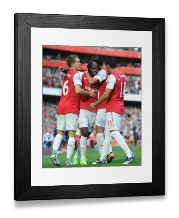 Framed Print : Arsenal's Triumph: Gervinho's Goal Celebration with Ramsey, Chamakh, and Santos (3-1 vs Stoke City, Premier League) Framed Print : Arsenal's Triumph: Gervinho's Goal Celebration with Ramsey, Chamakh, and Santos (3-1 vs Stoke City, Premier League)