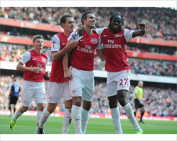 Robin van Persie celebrates scoring his 2nd goal Arsenals 3rd with Aaron Ramsey and Gervinho