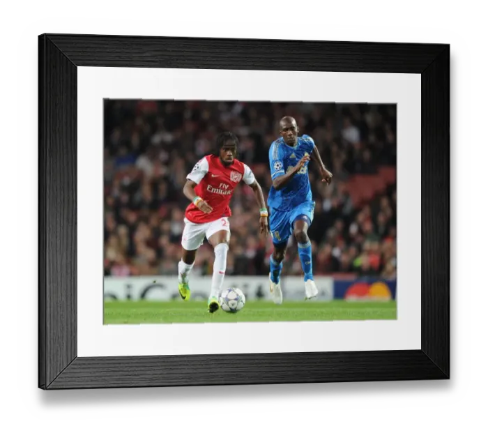 Framed Print : Gervinho vs. Diarra: Battle at Emirates Stadium - Arsenal FC vs. Olympique de Marseille, UEFA Champions League, 2011