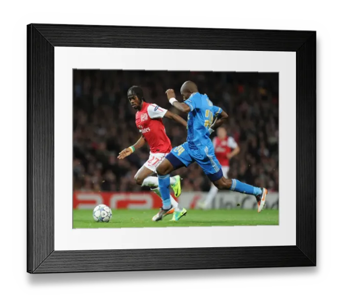 Framed Print : Arsenal vs Marseille: Intense Battle Between Gervinho and Rod Fanni in the 2011-12 UEFA Champions League