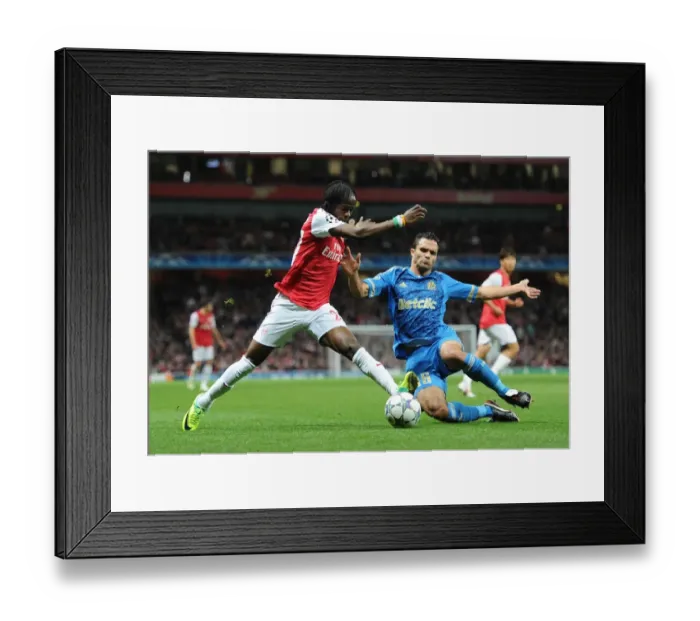 Framed Print : Arsenal's Gervinho Clashes with Marseille's Jeremy Morel in UEFA Champions League Showdown Framed Print : Arsenal's Gervinho Clashes with Marseille's Jeremy Morel in UEFA Champions League Showdown