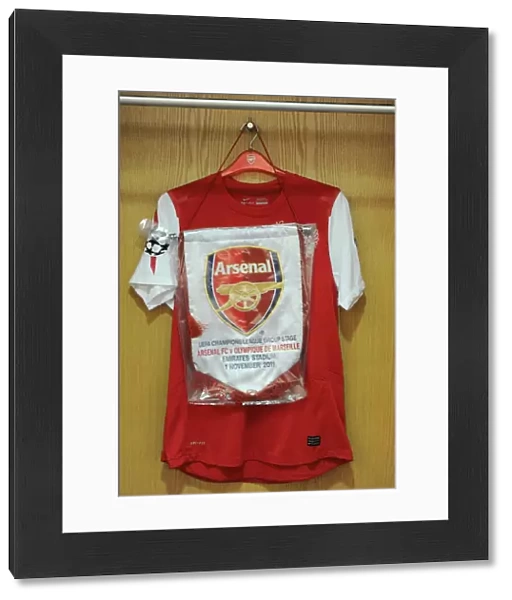 Match pennant hangs with the captains shirt. Arsenal 0: 0 Marseille. UEFA Champions League