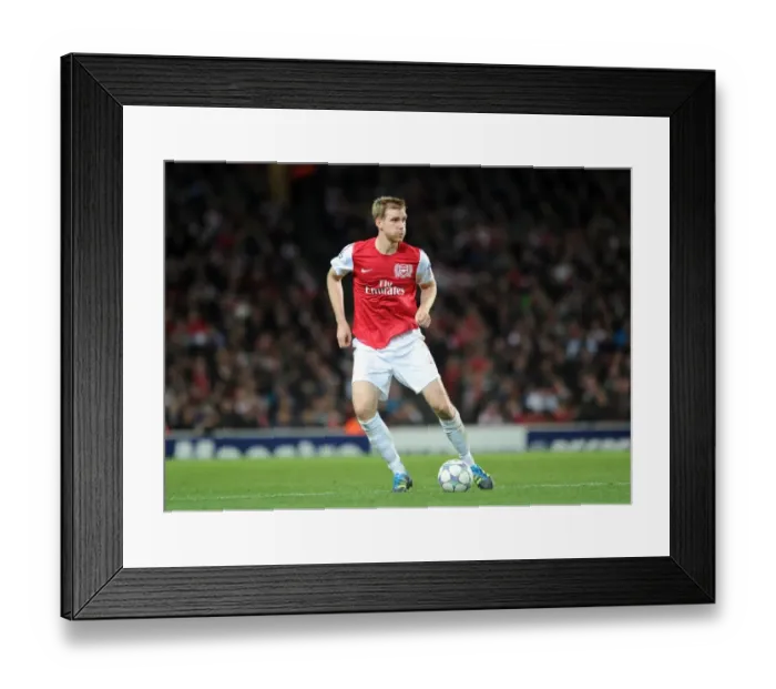 Framed Print : Per Mertesacker (Arsenal). Arsenal 0: 0 Marseille. UEFA Champions League Framed Print : Per Mertesacker (Arsenal). Arsenal 0: 0 Marseille. UEFA Champions League