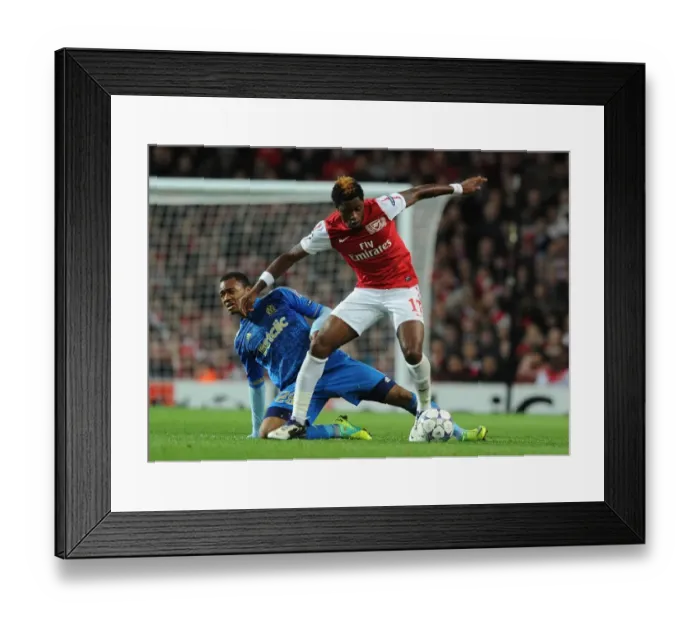 Framed Print : Arsenal vs. Marseille: Clash between Alex Song and Jordan Ayew in the 2011-12 UEFA Champions League Framed Print : Arsenal vs. Marseille: Clash between Alex Song and Jordan Ayew in the 2011-12 UEFA Champions League