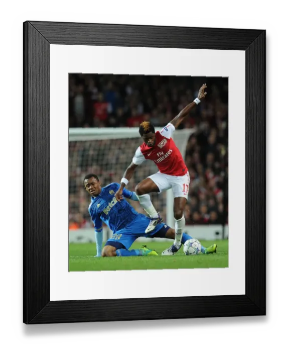 Framed Print : Arsenal vs Marseille: Clash between Alex Song and Jordan Ayew in the 2011-12 UEFA Champions League Framed Print : Arsenal vs Marseille: Clash between Alex Song and Jordan Ayew in the 2011-12 UEFA Champions League