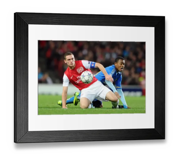 Framed Print : Thomas Vermaelen (Arsenal) Jordan Ayew (Marseille). Arsenal 0: 0 Marseille Framed Print : Thomas Vermaelen (Arsenal) Jordan Ayew (Marseille). Arsenal 0: 0 Marseille