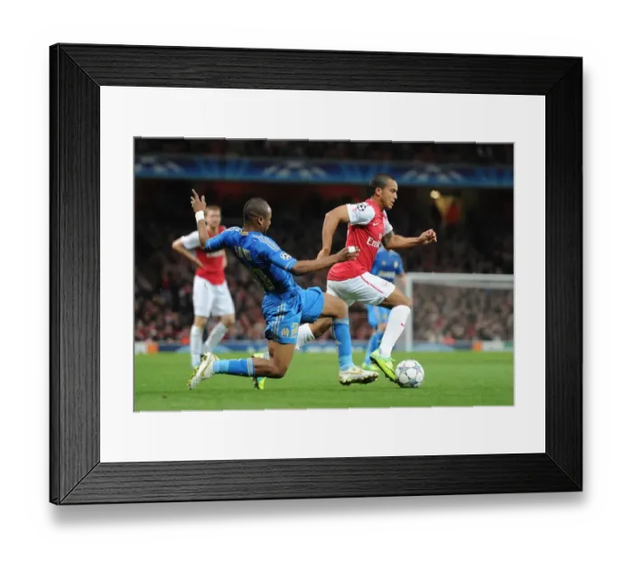 Framed Print : Arsenal vs. Marseille: Theo Walcott Clashes with Souleymane Diawara in the 2011-12 UEFA Champions League Framed Print : Arsenal vs. Marseille: Theo Walcott Clashes with Souleymane Diawara in the 2011-12 UEFA Champions League